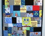 quilt with baby clothes