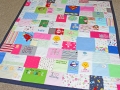 quilt made out of baby clothes
