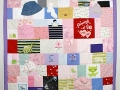 quilt made out of baby clothes