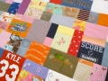 quilt with baby clothes