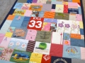quilt with baby clothes