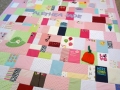 patchwork quilt from baby clothes