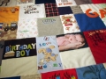 quilt made from baby clothes