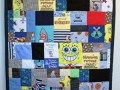 quilt with baby clothes