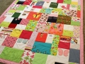 quilt made from baby clothes