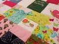 quilt made from baby clothes