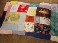 quilt made from baby clothes