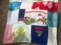 quilt made from baby clothes