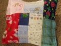 quilt made from baby clothes