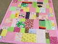quilt made from old baby clothes