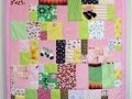 quilt made from old baby clothes