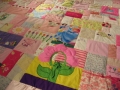 quilt made from baby clothes