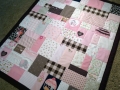 patchwork quilt from baby clothes