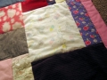 quilt made from baby clothes