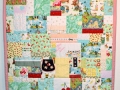 quilt with baby clothes