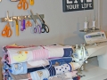 Stack of baby clothes quilts