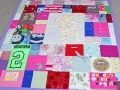 make a quilt out of baby clothes