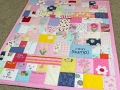 quilt made from old baby clothes