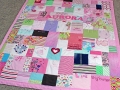 quilt made from old baby clothes