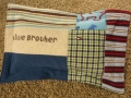 quilt with baby clothes