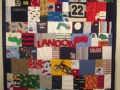 quilt with baby clothes